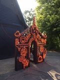 Neon gingerbread house in daylight