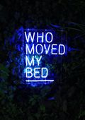 Neon sign reading "Who moved my bed"